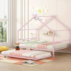 a child's bedroom with pink and white furniture in the room, including a bed frame