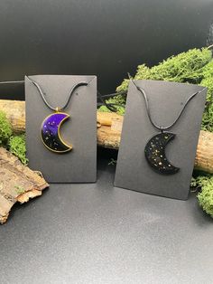 Gothic, Wicca and boho style  Moon Sparkle Pendants. Made out of Epoxy Resin with holographic glitter and real dried flowers. Add a bit of Sparkle and healing moon energy to your outfit. Can be Bought as a pair for friendship necklaces, mothers day present or even just as a gift for yourself. Perfect to accompany any outfit.  Necklace hangs to the middle of the chest. Leather cord is hypoallergenic and soft to wear. No nasty irritation or rashes. The Coated Frame is Durable and will last so long Mystical Moon Shaped Necklace Gift, Mystical Moon Shaped Necklace For Gifts, Magical Black Necklace For Gift, Mystical Moon Necklace For Gift, Mystical Crescent Necklace For Gifts, Black Necklaces For Gifts, Magical Black Pendant Necklace, Halloween Moon Charm Jewelry As Gift, Handmade Magical Necklaces For Festival