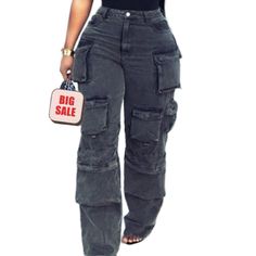 A Pair Of Cargo Pants That Are Perfect For Those Who Want To Stay Organized And Stylish. These Pants Feature Multiple Pockets That Provide Ample Storage Space For Small Items Such As Phones, Wallets, And Keys. The Straight Cut Of The Pants Provides A Classic And Timeless Look That Can Be Dressed Up Or Down, Making Them A Versatile Addition To Any Wardrobe Gray Pants With Pockets For Fall, Gray Fall Pants With Pockets, High Rise Gray Cargo Bottoms, Gray High Rise Bottoms With Cargo Pockets, High Rise Gray Bottoms With Cargo Pockets, Gray High Waist Pants With Pockets, High Waist Gray Pants With Pockets, Gray High-waist Pants With Pockets, Gray High Waist Cargo Pants