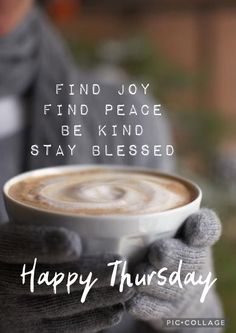 a person holding a cup of coffee with the words happy thursday