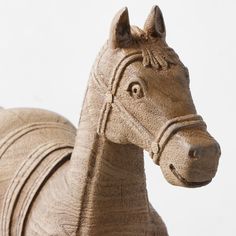 a close up of a horse statue on a white background with no people around it