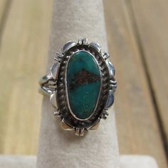 Southwest Vintage Green Turquoise Sterling Silver. The silver work is very nice and add so much to this stone. The turquoise stone is green with a hint of blue and measures approx. 15mm x 8mm. The face of the ring is 22mm x 15mm and the band is 4mm wide. The ring weighs 6g and is a size 6.75. I can offer sizing for an additional fee. Please message me what size you need and I will get back to you with a price. It is stamped sterling and the artists hallmark is NJ. Feel free to ask me questions a Silver Work, Green Turquoise, Turquoise Sterling Silver, Turquoise Stone, Tucson, Rings Statement, Sterling Silver Ring, Turquoise Ring, Turquoise Bracelet