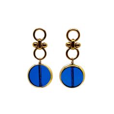 Another version of our Blue Circle Earrings, which is sold out and a customer favorite are these transparent blue circles. The German vintage glass beads that is framed with 24K gold hangs on a 24K gold plated circle earring studs. The vintage German glass beads were hand pressed during the 1920s- 1960s. No two beads are exactly alike. These beads are “New Old Stock” and are almost, if not some are 100 years old. These beads are no longer in production thus making them rare and highly collectibl Formal Gold Glass Earrings, Nickel-free Blue Circular Earrings, Blue Nickel-free Round Earrings, Nickel-free Blue Earrings, Modern Gold Glass Earrings, Elegant Blue Circular Jewelry, Handmade Blue Round Clip-on Earrings, Gold Glass Earrings For Pierced Ears, Blue Round Glass Earrings