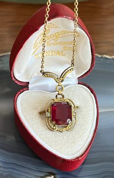 Item: Antique Art Deco Gold Filled Paste Ruby Seed Pearls Pendant Lavalier Drop Necklace. There are no stamps or hallmarks on this. Measurements: The chain is 18 inches long. The pendant is 1 & 3/8th inches long. Condition: Vintage, previously owned. Showing only minor signs of age/use/patina. There are a few tiny pin prick like nicks on the paste ruby. Please see our other listings, we combine shipping for savings. Art Deco Gold, Ruby Necklace, Seed Pearl, Antique Art Deco, Drop Necklace, Antique Art, Pearl Pendant, Aging Signs, Pendant Necklaces