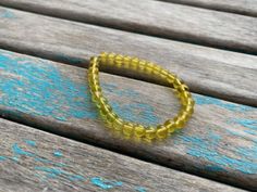 Great to wear alone, or layered with many other bracelets, this great yellow beaded bracelet will be the perfect addition to your outfit. The bracelet is made out of elastic and measures approximately 7 1/2 inches...the elastic allows for ease of wear and comfort with a bit of give on sizing. This bracelet is already made and can't not be resized or customized. Thanks! Be sure to scroll through all photos for answers to commonly asked questions. Thanks so much for shopping with me! Come back soo Yellow Beaded Bracelet, Grandmother Necklace, Mothers Bracelet, Handmade Gift Wrap, New Inventory, Light Weight Earrings, Acrylic Earrings, Circle Earrings