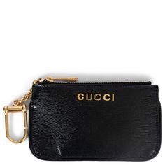 100% authentic Gucci logo card case in black grained leather featuring gold-tone hardware, a zipped top and key chain. Lined in black grosgrain. Has been carried and is in excellent condition. Measurements Model P00938336 Width 13.5cm (5.3in) Height 7.5cm (2.9in) Depth 0.4cm (0.2in) Hardware Gold-Tone All our listings include only the listed item unless otherwise specified in the description above. Chic Gold Gucci Wallet On Chain, Gucci Logo, Card Case Wallet, Luxury Wallet, Gucci Leather, Credit Card Wallet, Hardware Gold, Leather Logo, Gucci Black