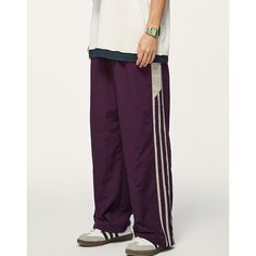 Sports Color Contrast Elastic Waist Wide Leg Casual Pants Material: 100% Nylon Size: S, M, L, XL, 2XL Color: Purple, Black Applicable Season: Spring, Summer Purple Pants For Men, Sporty Solid Color Nylon Pants, Sporty Nylon Pants In Solid Color, Solid Nylon Sportswear Pants, Moisture-wicking Nylon Full Length Pants, Casual Solid Nylon Sweatpants, Casual Gym Pants With Elastic Side Panels, Baggy Parachute Pants For Sports With Elastic Waistband, Sporty Wide Leg Nylon Sweatpants