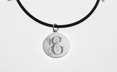 This elegant necklace is sure to bring you many compliments !  I will carefully engrave a single, beautifully ornate script initial on this high polish 7/8" diameter sterling silver disc.  Take a look at the last picture - I have engraved a sample of each letter, so you can see what yours will look like! This lovely necklace is suitable for every day wear or formal events.The finished piece will be suspended on your choice of:*16" rubber cord with stainless steel lobster clasp or*18" rubber cord Engraved Circular Jewelry Gift, Etched Necklaces For Anniversary, Etched Necklace For Anniversary, Etched Round Necklace For Anniversary, Elegant Etched Round Disc Necklace, Etched Medallion Necklace For Anniversary, Personalized Engraved Circular Jewelry, Medallion Etched Necklace For Anniversary, Anniversary Etched Medallion Necklace