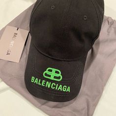 Brand New Blenciaga Green Logo Hat. Never Worn, Has Original Tag And Dust Bag. Designer Black Hats For Spring, Luxury Black Hat For Spring, Designer Black Spring Hats, Designer Black Hat For Streetwear, Designer Black Cap, Green Balenciaga, Balenciaga Baseball Cap, Balenciaga Pouch, Balenciaga Cap