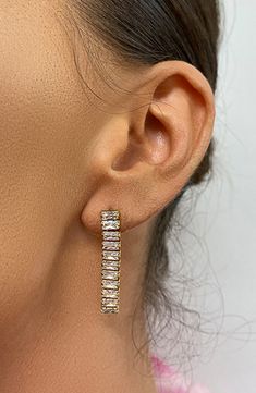 Blue crystal baguettes create tennis bracelet inspired drops that shape these unique earrings. 1.25" length Post back 14K yellow gold plated stainless steel/crystal Imported Party Earrings With Baguette Diamonds, Bracelet Inspired, Round Earrings, Tennis Bracelet, Blue Crystals, Unique Earrings, Baguette, Nordstrom Rack, Ear Cuff