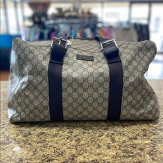 Gucci Duffle Bag In Gg Supreme Canvas. Used A Few Times. Marks Shown On Corners, Clean Interior, Almost Like New. Genuine, But Lost The Tags. Hard To See Gucci Number But It Is There (Better To See In Person). Does Not Have Dust Bag. Measures: 20in Length, 10in Width, 10in Height. Wear Shown On Handle Gucci Duffel Bag Travel, Gucci Duffle Bag, Bags Gucci, Gucci Vintage, Gucci Bags, Vintage Gucci, Louis Vuitton Damier, Gucci Bag, Travel Bags