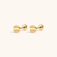 the gold stud earrings are made from brass, and have round posts on each side