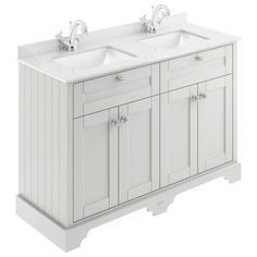 a white double sink vanity with two faucets on the top and one basin