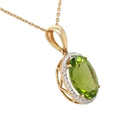 This 4.96ct peridot and diamond pendant in 18k yellow gold exudes timeless elegance and unmatched luxury. Crafted from natural peridot and natural diamonds in 18kt yellow gold, it is finished with an exquisite 18" cable chain, creating a piece of heirloom-quality jewelry worthy of admiration. This spring green peridot pendant is sure to become a treasured family heirloom. Click here to read more about Peridot Luxury Classic Peridot Jewelry, Peridot Necklace Pendant, Luxury Peridot Pendant Necklace, Peridot Pendant, Halo Pendant, Green Peridot, Yellow Gold Chain, Family Heirloom, Gems And Minerals