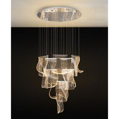 a modern chandelier hanging from the ceiling