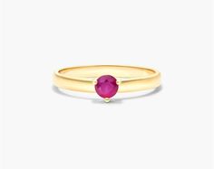 The 14K Yellow Gold 2.3mm Ruby Solitaire Birthstone Ring is a stunning and elegant piece of jewelry that is perfect for any occasion. The ring features a fiery ruby gemstone that is set in a 14K yellow gold band. Ruby is the birthstone for July, and it is known for its beauty and symbolism of love, passion, and romance. This ring is the perfect way to add a touch of color and sparkle to your look. The ring is made of high-quality materials that will last for years to come. The ruby is a natural Yellow Gold Birthstone Ring With Round Cut Lab-created Ruby, Yellow Gold Birthstone Ring With Lab-created Ruby, Yellow Gold Birthstone Ring With Round-cut Lab-created Ruby, Yellow Gold Lab-created Ruby Birthstone Ring, Classic Ruby Solitaire Birthstone Ring, Classic Ruby Birthstone Ring With Round Band, Classic Solitaire Ruby Birthstone Ring, Yellow Gold Ruby Ring With Round Cut Lab-created Ruby, Yellow Gold Birthstone Ring With Prong-set Lab-created Ruby