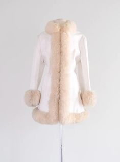 Discover timeless style with our Penny Lane Coat for women, a stunning blend of vintage charm and modern elegance. Embrace the allure of the 90s with this Shearling Fur Coat, featuring a luxurious white long design reminiscent of Boho Hippie and Afghan influences. Crafted from high-quality sheepskin, suede leather, and wool materials, this Y2K-inspired piece exudes warmth and sophistication. Elevate your winter wardrobe with the perfect fusion of retro and contemporary fashion. Embrace the disti Winter White Sheepskin Outerwear With Faux Fur Trim, Winter White Sheepskin Fur Coat For Fall, Chic White Sheepskin Outerwear, White Sheepskin Outerwear For Winter, White Sheepskin Winter Outerwear, White Fitted Long Fur Coat, Winter White Fitted Faux Fur Coat, Fitted Winter White Faux Fur Coat, White Sheepskin Outerwear With Faux Fur Trim