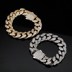 Put some Cuban flavor into your style with this 18mm Cuban link bracelet. It's crafted with high quality gold plating and adorned with cubic zirconia stones for a touch of luxury. The Cuban link design is classic and stylish, and it's sure to make a statement whether you're dressing up or dressing down.This bracelet is the perfect way to add a little bit of edge to your outfit. Whether you're going for a night out on the town or just hanging out with friends, this bracelet will help you make a s Luxury Bling Cuban Link Bracelets, Luxury Cuban Link Bracelet With Bling, Gold Cuban Link Bracelet With Bling, Classic Cuban Link Bracelet With Cubic Zirconia, Elegant Iced Out Cuban Chain Link Bracelet, Iced Out Gold Chain Link Bracelet, Iced Out Cuban Link Cubic Zirconia Bracelet, Elegant Iced Out Cuban Link Bracelet, Luxury Cuban Link Chain Bracelet With Cubic Zirconia