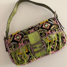 Authenticity Guaranteed. Vintage Fendi Baguette; Black With One-Of-A-Kind Hand Beading Of Seed Beads And Mother Of Pearl Shell. Front Flap Features Pink Fringe And Closure F Logo In Green And Pink Python Skin. Interior Is Lime Green Python Belly And Baby Pink Silk Satin. Great Condition!! A Few Missing Beads. Please Ask All Questions And Check Photos. Fendi Multicolor Bag, Fendi Baguette Black, Vintage Fendi Baguette, Baby Pink Silk, Green Python, F Logo, Python Skin, Vintage Fendi, Fendi Baguette