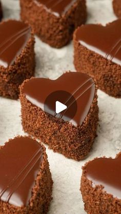 heart shaped brownies with chocolate frosting on top