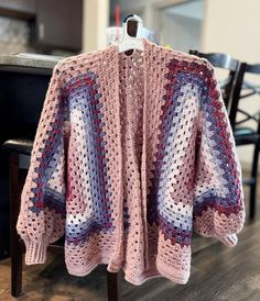 This cute oversized cardigan is 100% handmade and fits like a women's L/XL. The oversized fit is cozy and perfect for fall/winter. You're bound to get compliments in this one-of-a-kind piece!  The sleeve cuffs are slightly tighter, but should stretch over time as worn. Hand wash and air dry. Cozy Crochet Outerwear One Size, Cozy Oversized Crochet Outerwear, Oversized Crochet Outerwear For Fall, One Size Fall Crochet Cardigan, Cozy Crochet Sweater Coat For Fall, Cozy Crochet Sweater For Fall, Handmade Cozy Sweater Coat For Fall, Oversized Crochet Sweater For Winter, Oversized Crochet Sweater Coat For Fall