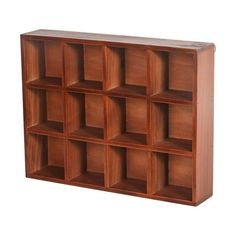 a wooden shelf with many compartments on it