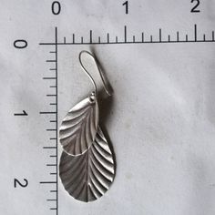 Sterling silver leaf design dangle earrings Approximately H 2.25 X W 1 inches Silver Earrings Dangle, Silver Leaf, Pure Silver, Leaf Design, Low Maintenance, Sensitive Skin, Floating, Dangle Earrings, Pure Products