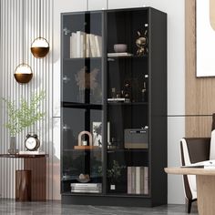 a black bookcase in the corner of a room next to a table and chairs