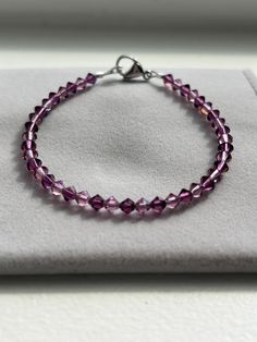 Beautiful Amethyst Swarovski/Preciosa Cyrstal Bracelet! This handmade bracelet features genuine crystals with a stainless steel lobster clasp. This bracelet is perfect for anyone who loves purple! It has a brilliant sparkle; especially in the sun or any kind of light. This specific bracelet measures at approximately 7" (see last photo) and is ready to ship. If you need a different size, just message me and I can custom make one for you! All of my bracelets are handmade with love by me! Thank you for looking and supporting my small business! Purple Crystal Bracelets, Faceted Crystal Bracelet For Jewelry Making, Purple Hypoallergenic Crystal Bracelet Gift, Sterling Silver Faceted Crystal Bracelet Gift, Elegant Hypoallergenic Purple Beaded Bracelets, Adjustable Purple Crystal Jewelry, Purple Crystal Bracelets With Round Beads, Adjustable Faceted Sterling Silver Crystal Bracelet, Purple Crystal Bracelets As Gift