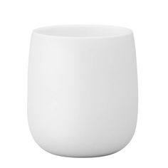 a white cup sitting on top of a table