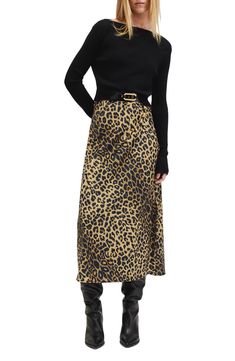 Achieve effortless layering with this two-piece set including a ribbed, cropped sweater and a sassy leopard-print slipdress. 42 1/2" length dress; 16" length sweater (size Medium) Dress has V-neck; adjustable straps Sweater has boat neck; long sleeves Dress is 96% polyester 4% elastane; sweater is 71% viscose, 29% polyester Dry clean Imported Leopard Dress Outfit Night, Layered Slip Dress Outfit, Slip Dress With Sweater, Leopard Print Skirt Outfit, Slip Dress Layering, Printed Skirt Outfit, Cheetah Print Skirt, Dress Layering, Print Slip Dress