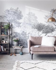 a living room filled with furniture and wallpaper