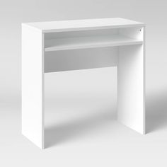 a white desk sitting on top of a white floor