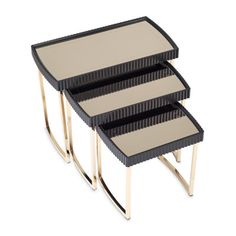 three black and gold nesting tables on white background