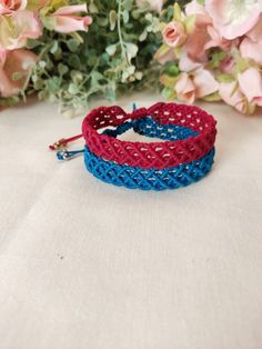 Macrame Bracelet set of 2, made with fine quality waxed thread, in bright red and blue color. Water and sun resistant. These bracelets fit all wrist sizes with an adjustable sliding knot closure. For women with unique and alternative style. Dimension : 0,3" Casual Red Friendship Bracelets With Adjustable Cord, Bohemian Blue Waxed Cord Bracelet, Blue Adjustable Cord Friendship Bracelets For Festivals, Blue Bohemian Braided Bracelets With Waxed Cord, Blue Braided Bracelet With Adjustable Cord For Festivals, Red Waxed Cord Bracelet With Sliding Knot, Red Macrame Beaded Bracelets For Friendship, Red Adjustable Cord Friendship Bracelets For Beach, Handmade Blue Braided Bracelets With Waxed Cord