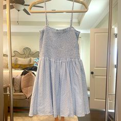 The Lulus Treat Me Right Light Blue Gingham Smocked Mini Dress Is So On Trend And Sweeter Than Pie! Lightweight Woven Fabric, In A Blue And White Gingham Pattern, Creates This A Ruffled Straight Neckline, A Fully Smocked Bodice, And Adjustable Skinny Straps. A Slightly Flared Skirt Flows Below The High Waist To A Flirty Mini Length. Skirt Is Lined. Shell: 70% Polyester, 30% Rayon. Lining: 100% Rayon. Blue And White Checkered Dress, Picnic Mini Length Dress With Smocked Bodice, Picnic Mini Dress With Smocked Bodice, Mini Length Smocked Bodice Dress For Picnic, Mini Length Dresses With Smocked Bodice For Picnic, Casual Gingham Dress With Ruched Details, Casual Ruched Gingham Dress, Spring Sleeveless Smocked Gingham Dress, Sleeveless Gingham Smocked Dress For Spring