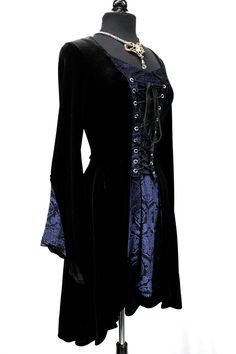 "A romantic, medieval style dress with elegance. Rich stretch velvet body and sleeves and low cut neckline with velvet insets on the front and on both sleeves. Adjustable lace-up front for a flattering, custom fit on all body types. Bell sleeves and a long flowing hem-line Comes in sizes small-XXL. Very eleganta Shrine classic Size Measurements: Small - Chest 38\" Waist 29\" Hips 44\" Medium - Chest 40\" Waist 32\" Hips 46\" Large - Chest 42\" Waist 34\" Hips 48\" XL - Chest 45\" Waist 37\" Hips Romantic Medieval, Medieval Style, Medieval Fashion, Sleeveless Hoodie, Stretch Velvet, Women's Costumes, Womens Size Chart, Blue Velvet, Style Dress