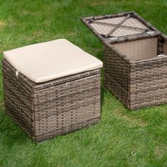 two wicker baskets sitting on top of green grass