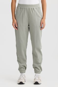 Comfort meets style with the Lena Track Pant Dusty Olive. Crafted from 100% mid weight Terry Cotton, these track pants are a must have addition to your athleisure collection. 100% Cotton French Terry Classic track pant with elasticated waist and design seam detailing Embroidered classic logo Elasticated cuffs Cutaway pockets Sporty Pants With Elastic Cuffs And Relaxed Fit, Joggers With Elastic Side Panels In Solid Color, Trendy Relaxed Fit Joggers With Ribbed Waistband, Athleisure Sweatpants With Ribbed Waistband, Sporty Joggers With Elastic Waistband, Sporty Joggers With Elastic Side Panels For Leisure, Sporty Bottoms With Elastic Cuffs And Straight Hem, Relaxed Tapered Leg Sweatpants In Solid Color, Relaxed Fit Pull-on Tapered Leg Sweatpants