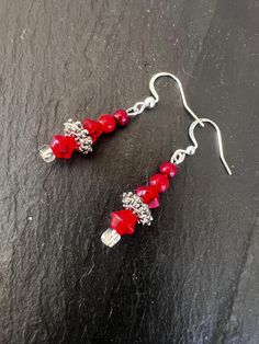 Earrings with red glass beads and silver accents.  Matching necklace here: https://deuxbijouxstudio.etsy.com/listing/1779435079 Red Sterling Silver Beaded Earrings, Red Beaded Sterling Silver Earrings, Nickel-free Red Beaded Sterling Silver Earrings, Red Sterling Silver Nickel-free Beaded Earrings, Red Sterling Silver Beaded Earrings Gift, Red Sterling Silver Dangle Crystal Earrings, Red Czech Glass Earrings With Dangling Beads, Red Czech Glass Beaded Earrings With Dangling Beads, Elegant Red Czech Glass Beaded Earrings