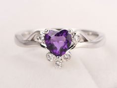 Welcome to my shop, you can find many beautiful gemstone jewelry here, and you also can ask for customized service. Main Stone: 6*6 mm heart cut natural amethyst Accent Stones: cz Metal: 925 sterling silver plated with rhodium. I also can provide metal options such as 14k solid yellow/white/rose gold Setting: prong setting More rings please go to my shop home: https://www.etsy.com/shop/XCjewelryStudio?ref=hdr_shop_menu It's a perfect gift for who born in February (birthstone),it's quite comforta Elegant Amethyst Heart-shaped Birthstone Ring, Elegant Heart-shaped Amethyst Ring With Accent Stones, Elegant Purple Heart Ring For Anniversary, Elegant Amethyst Heart Promise Ring, Elegant Heart-shaped Amethyst Ring, Elegant Purple Heart Promise Ring, Heart Shaped Amethyst Jewelry For Wedding, Heart-shaped Amethyst Wedding Jewelry, Elegant Heart-shaped Amethyst Ring Gift