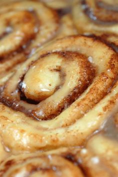 cinnamon rolls with icing in a pan ready to be baked