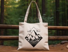 "Introducing my Retro Mountain Cotton Canvas Tote Bag, the perfect companion for all your outdoor adventures! Whether you're hiking, camping, or simply exploring nature, this versatile bag has got you covered. Crafted from durable cotton canvas, it can withstand whatever the rugged outdoors throws at it. Featuring a spacious interior, it's ideal for storing your hiking essentials, travel pouch, or camping duffel bags. With its trendy retro design, this shoulder bag is not only functional but also a stylish statement piece. Embellished with a striking tree motif, this hippie beach bag embodies the spirit of nature and wanderlust. Embrace the call of the wild and embark on your next adventure with my Retro Mountain Cotton Canvas Tote Bag. Be sure to paste this link into your browser to join Casual Eco-friendly Canvas Travel Bag, Eco-friendly Canvas Tote Bag For Outdoor, Casual Canvas Tote Bag For Outdoor Activities, Eco-friendly Canvas Bag For Outdoor, Eco-friendly Outdoor Tote Shoulder Bag, Eco-friendly Bags For Outdoor Activities, Eco-friendly Rectangular Outdoor Bag, Eco-friendly White Outdoor Bags, Eco-friendly Canvas Bag For Outdoor Activities