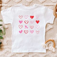 Great shirt for that favorite toddler in your life! Such a sweet shirt and very soft and comfortable. Bella Canvas Kids Rabbit Skins Next Level Heart Tshirt, Valentines Day, Gift, Love Tshirt Cute White T-shirt For Valentine's Day, Playful Graphic Print T-shirt For Valentine's Day, White T-shirt With Heart Print For Mother's Day, White Heart Print T-shirt For Mother's Day, Cute Heart Print Tops For Valentine's Day, Playful Crew Neck T-shirt For Valentine's Day, Playful Valentine's Day Crew Neck T-shirt, Cute Heart Print T-shirt For Valentine's Day, Playful White Heart Print Tops