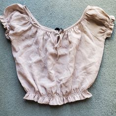 Nwt Rinascimento Ruffled Beige Crop Blouse Size Small. Beige Crop Ruffled Blouse, With Elastic Band At The Waist And On The Sleeves. Tie At The Neckline. Purchased From A Boutique In Italy Made From Italian Materials. Never Worn. No Flaws, Rips, Or Stains. Paid 39 Euros For It. Measures 15 In Long X 14 In Wide. Casual Beige Ruffled Peasant Top, Vacation Ruffle Crop Top, Vacation Ruffled Crop Top, Feminine Ruffled Tops, Feminine Beige Peasant Top For Summer, Fitted Ruffle Peasant Top For Vacation, Beige Ruffled Tops For Vacation, Fitted Beige Peasant Top For Summer, Cropped Shrug