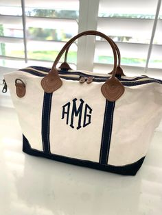 "High Quality Monogrammed Weekender Duffel Bag Whether you're off on business, visiting family and friends for the weekend, or headed off to college in need of a large accommodating Duffel, the Weekender is your go-to travel bag. ＊＊＊Placing a Order＊＊＊ Please Copy and Paste in \"Notes To Seller\": 1. Font Style  2. Thread Color 3. Initials or Name Font Samples and Threads swatch are listed on the photo section. Traditional Women's and Couple's monogram is First/LAST/Middle  (Example: ''Emma Marie Bates'' eBm) Traditional Men's Monogram is First/Middle/Last (Example:'' Preston Logan Bates '' PLB) ＊＊＊＊＊＊＊＊＊＊＊＊＊＊＊＊ DETAIL of the Weekender Bag Size : 15\" H X 28\" W X 10\" D zip closure,1 inner zip & 2 regular inner pockets 15\" leather handle Top Zip Closure. Heavy canvas designed to hold its Personalized Canvas Bag For Everyday Use, Personalized Tote Shoulder Bag For Travel, Customizable Travel Tote Bags, Personalized Rectangular Canvas Bags, Personalized Tote Bags For Travel, Navy Rectangular Bags For Weekend Trips, Personalized Canvas Bags For Gifts, Monogram Tote Bag For Everyday Use, Everyday Monogram Tote Bag