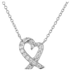 Platinum Tiffany Paloma Picasso diamond heart pendant. 17 round brilliant cut diamonds set in a heart shaped pendant. 16 inch chain. 17 round diamonds approx. total weight .12cts. Stamped: Paloma Picasso T+C. 3.1 grams. ½ x 3/8 inch. Chain: 16 inches. Paloma Picasso, Heart Pendant Diamond, Heart Shape Pendant, Tiffany And Co, Diamond Heart, Round Brilliant Cut Diamond, Brilliant Cut Diamond, Paloma, Tiffany & Co.