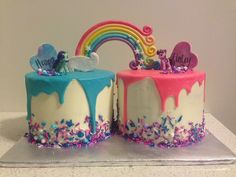 two birthday cakes decorated with rainbows and hearts