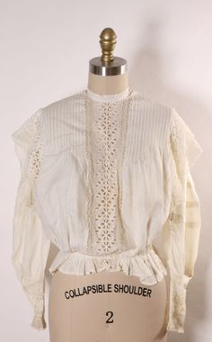 Antique 1910s Edwardian White Lace Long Sleeve Blouse This blouse features: *White color  *Lace details *3/4 length sleeves *Button up back  Size: X-Small  Measurements: Bust: 37" Waist: 25" Length: 20 1/2" Condition: Excellent If you have any questions, please ask! Find even more Vintage XX Small-X Small at: https://www.etsy.com/shop/NaughtyKittyVintage?section_id=17605974&ref=shopsection_leftnav_6 Thanks! -NaughtyKittyVintage Fitted Vintage White Blouse For Daywear, Victorian Long Sleeve Tops For Spring, Spring Victorian Blouse For Formal Occasions, Victorian Style Formal Blouse For Spring, Victorian Spring Daywear Blouse, Spring Victorian Blouse For Daywear, Victorian Long Sleeve Blouse For Vintage Fashion, White Long Sleeve Victorian Top, Victorian Blouse With Lace Collar