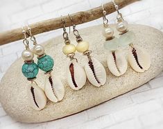 Sun Sea Studio https://www.etsy.com/listing/928241980/cowrie-shell-earrings-hawaiian-pearl Beachy Jewelry Happygolicky Jewelry, Bohemian Dangle Jewelry For Beach Season, Bohemian Shell Earrings For Gift, Handmade Adjustable Ocean-inspired Earrings, Beachy Shell-shaped Earrings For Gift, Shell-shaped Jewelry With Matching Earrings For The Beach, Adjustable Drop Earrings For Vacation, Handmade Beachy Earrings For Beach Season, Bohemian Shell-shaped Earrings For Gift